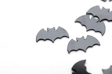 Black bat shapes on a white background. Halloween background