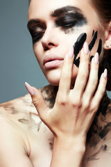 Beautiful Young woman with Paint Face