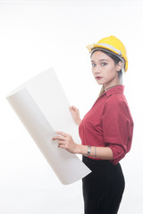 Beautiful engineering woman reading blueprint with yellow helmet and red shirt with white background, Studio light portrait