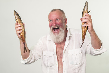 Satisfied and crazy man with 2 fishes in his hands, gray hair
