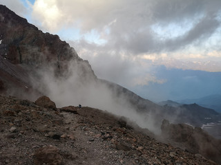 Mountain climbers surrounded by clouds