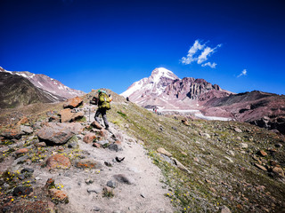 Fototapeta na wymiar Montain climber going toward his goal