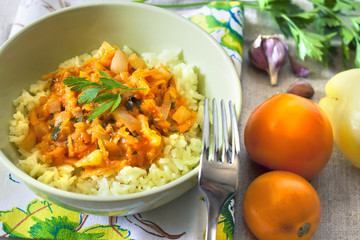Steamed rice with stewed vegetables and turmeric