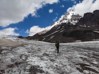 Mountaineer limbing a glacier near Mountain