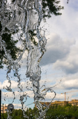 transparent falling water vertical flows, close up