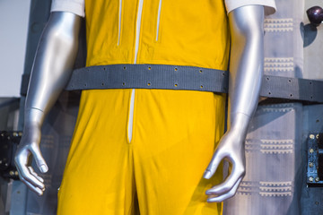 pilot in yellow overalls fastened to an space rocket © Denis Starostin