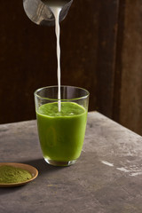 Matcha green tea latte in glass cup