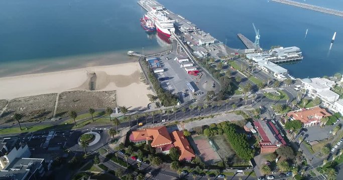 Ferry terminal, wharf and trans tasman ferry under cargo load in Port Melbourne on Port Phillip Bay, Melbourne, Victoria.
