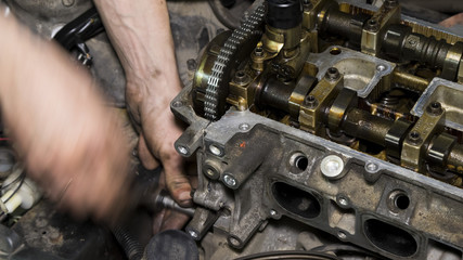 Fototapeta na wymiar Mechanic repairs the car engine