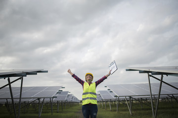 Fototapeta na wymiar Engineer electric woman checking and maintenance of solar cells.