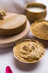 Herbal or Ayurvedic face Pack using Multani mitti, milk etc placed with Soap, towel. Selective focus
