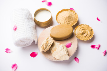 Herbal or Ayurvedic face Pack using Multani mitti, milk etc placed with Soap, towel. Selective focus