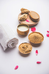 Herbal or Ayurvedic face Pack using Multani mitti, milk etc placed with Soap, towel. Selective focus