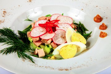 Okroshka with radish, eggs and herbs