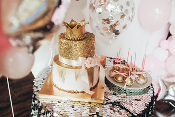 photo of a birthday party with cake and balls