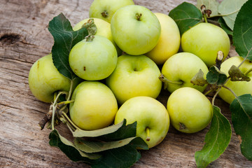 Fresh ripe apples on rustic wooden table