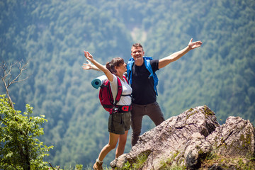 Couple of hikers at nature.Successful hikers enjoying the view