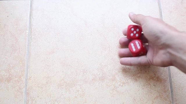 cubes in hand, concept of luck. Video close-up, high quality