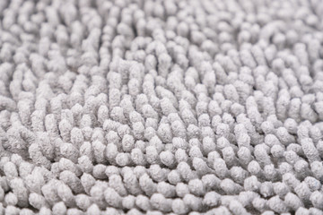 Gray carpet texture. Doormat carpet closeup. Pattern, details