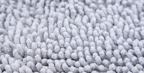 Gray carpet texture. Doormat carpet closeup. Pattern, details