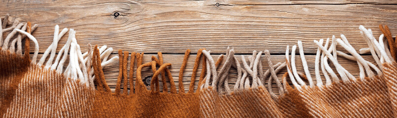 Warm wool throw on wooden background, blanket, long banner