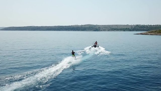Water skiing start behind a rubber speedboat at Kornati Croatia