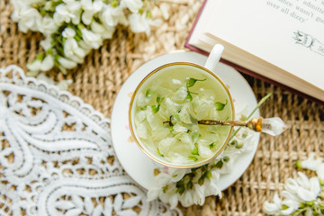 Acacia tea brewed in a cup is on the table