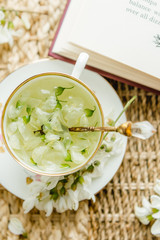 Acacia tea brewed in a cup is on the table