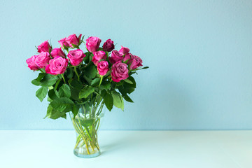 Bouquet of roses is on the table