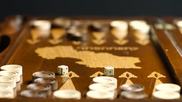 Throwing dices to backgammon table