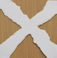 torn white paper texture on wood background, copy space.