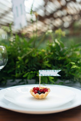 Elegant wedding table arrangement, floral decoration, restaurant. Wedding table setup. Wedding in the forest