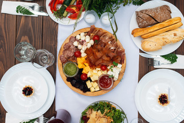 Elegant wedding table arrangement, floral decoration, restaurant. Wedding table setup. Wedding in the forest