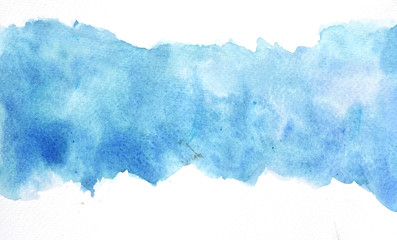 Abstract blue watercolor background hand painted on white