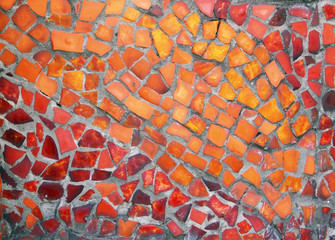 Detail of a beautiful old crumbling abstract ceramic mosaic building decoration, decorative background. Abstract design. Abstract mosaic colored ceramic stones