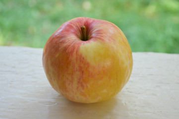 Ripe apple on the window