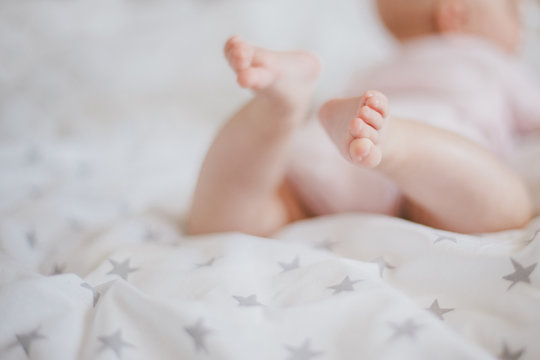 Little Baby Feet On A Swaddle Blanket