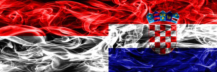 Indonesia vs Croatia smoke flags placed side by side. Thick colored silky smoke flags of Indonesian and Croatia