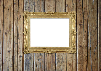 Old antique gold frame on textured wooden wall