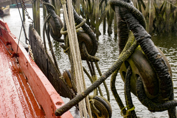 Old boat pulley with ropes on old sailing ship