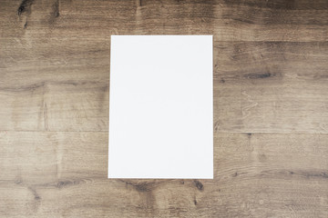 White paper and space for text on old wooden background