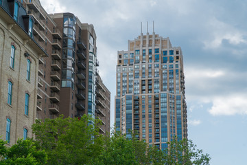 Establishing shot outside waterfront riverside luxury apartment buildings in urban city. Expensive real estate development in population growth areas of the united states