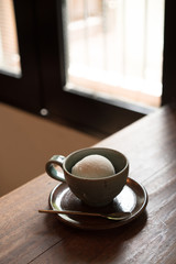 cup of ice cream on wooden vintage Table