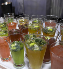 mocktails glasses garnished with lemon and mint