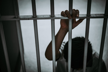 Hands of men desperate to catch the iron prison,prisoner concept,thailand people,Hope to be free.