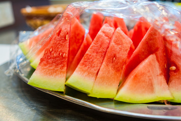 Slices of Fresh Watermelon on a Metal Platter