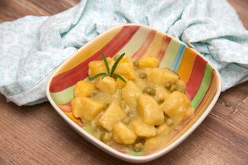 Homemade vegetarian dish with potatoes and peas