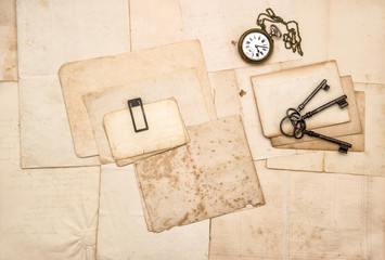 Vintage letters keys pocket watch Flat lay paper background
