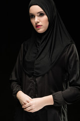 Portrait of young Muslim woman in traditional clothes