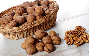 pile of walnuts on a white wooden table